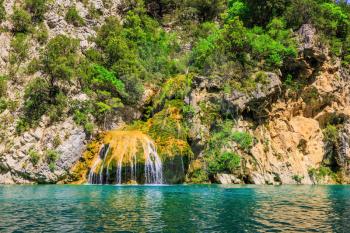 Scenic round waterfall in the side wall of the canyon Verdon. National park Merkantur, Provence, France