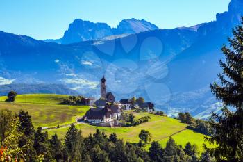 Little village in the Dolomites. Magnificent Tyrol. Journey to the fairy-tale country. The concept of ethnographic and ecotourism