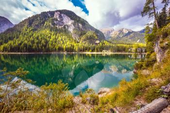 Walk around the Alpine lake Lago di Braies. Travel to the Southern Tyrol, Italy. The concept of environmental and hiking