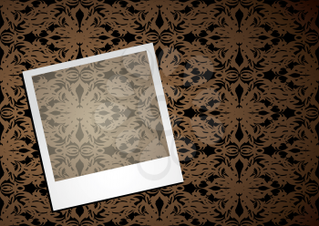 Royalty Free Clipart Image of a Polaroid on Wallpaper