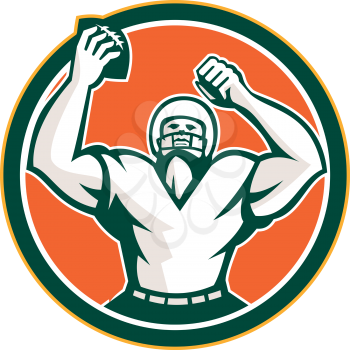 Illustration of an american football with helmet holding ball over head celebrating viewed from the front set inside circle on isolated background done in retro style. 