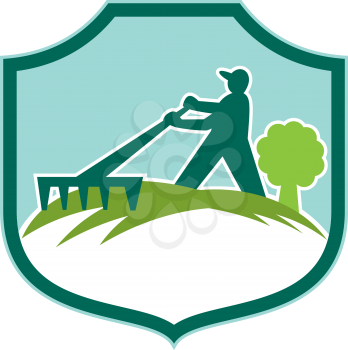 Illustration of male gardener landscaper horticulturist with rake set inside shield crest on isolated background done in retro style. 