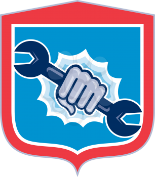Illustration of a mechanic hand holding spanner wrench punching bursting out of circle shape viewed from front set inside shield crest on isolated background done in retro style.