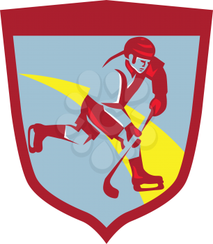 Illustration of a ice hockey player skating with stick striking viewed from the side set inside shield crest done in retro style.