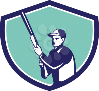 Illustration of a hunter wearing hat holding shotgun rifle looking to the side set inside shield crest on isolated background done in retro style. 