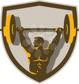 Illustration of a weightlifter lifting barbell weights with both hands looking to the side viewed from front set inside shield crest done in retro style. 