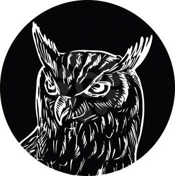 Retro woodcut style illustration of head of a great horned owl viewed from front set in circle on isolated background done in black and white.