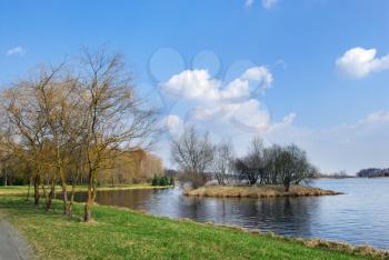 Royalty Free Photo of a Lake With a Small Island and Trees