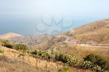 Shore of Lake Kinneret, the slopes of the Golan Heights in Israel