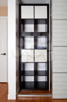 Built-in closet with sliding door shelving storage organization solution, empty shelves