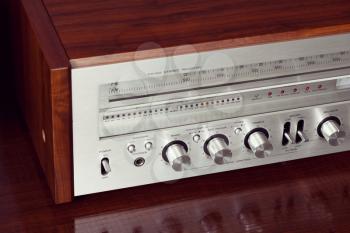 Vintage Analog Retro Stereo Radio Receiver Shiny Front Panel Angled View