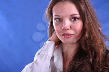 young woman portrait, studio shoot on blue