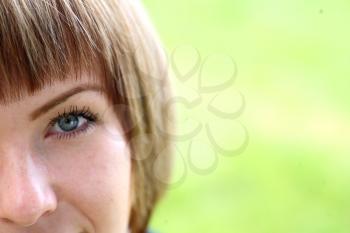 Half face of lovely girl close up outdoors portraite