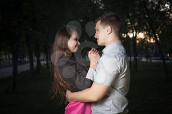 Young couple in love. in the evening park
