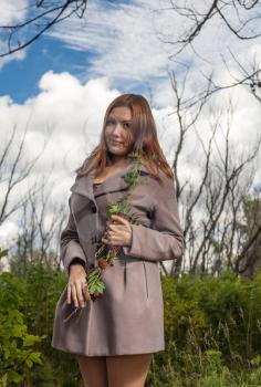 foxy-red haired women outdoors weared jacket at autumn time