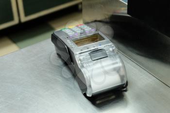 Empty cash desk with terminal in supermarket, a lot of copyspace