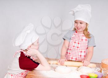 girl and boy say and prepare meal