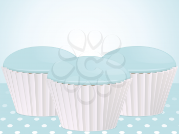 blue cupcakes in white cases on a blue polka dot background