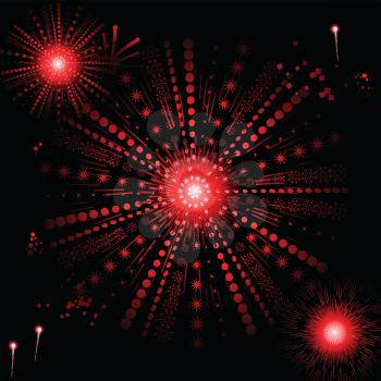 Glowing red snowflake fireworks on a black background