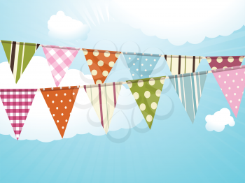 Bunting against a blue sky with fluffly clouds