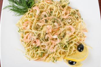 Royalty Free Photo of Pasta With Shrimp and Lemons 