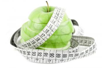 Royalty Free Photo of Measuring Tape Wrapped Around an Apple

