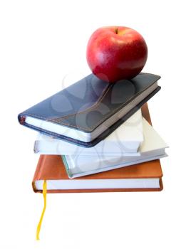 Back to school concept with books and apple on white