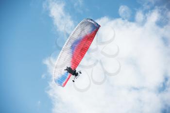 Paragliding in mountains. Para gliders in fight in the mountains, extreme sport activity.