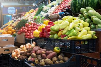 Vegetable farmer market counter: colorful various fresh organic healthy vegetables at grocery store. Healthy natural food concept