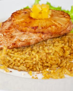 chicken fillet baked with pineapple, with rice and salad