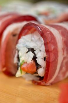 Japanese cuisine - sushi roll with bacon