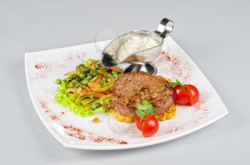 Beef steak meat with vegetables and sauce