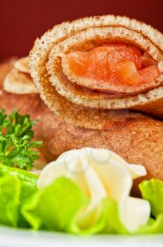 Pancakes with salted red salmon fish