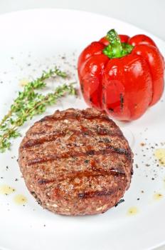 grilled beef steak with herbs and pepper