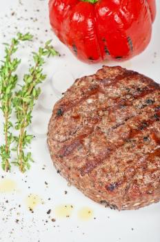 grilled beef steak with herbs and pepper