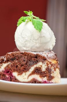 A slice of chocolate cake with ice cream