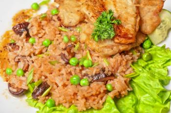 Roast pork and rice with vegetables and mushrooms