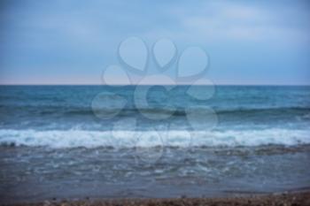 Blurred view from blue sea with waves and sky