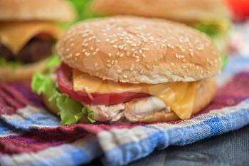 Closeup of home made burgers on wooden table