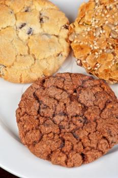 Mixed cookies on a white plate