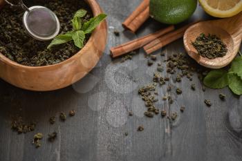 tea composition with cinnamon sticks, lemons