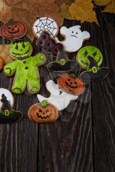 Homemade delicious ginger biscuits for Halloween on wooden table