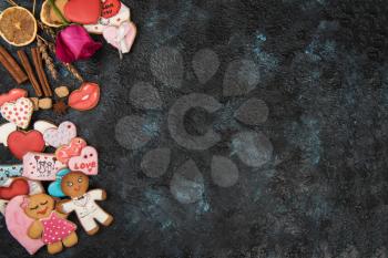 Gingerbreads for Valentines Day on dark concrete background