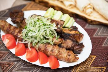 Grilled shish kebab or shashlik meat with vegetables