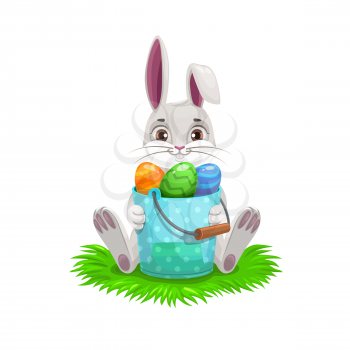 Bunny with Easter egg hunt bucket, Easter religion holiday vector design. White spring rabbit or hare with colorful eggs sitting on green grass. Egghunting party and kids competitive game themes