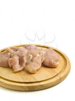 Close-up of raw Chicken fillet on hardboard over white