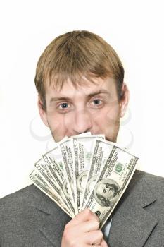 Smiling Businessman with hundreds of dollars isolated over white 