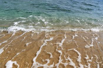 Clear sea water in the coastal sand, nature background