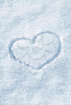 The shape of heart painted on the white snow