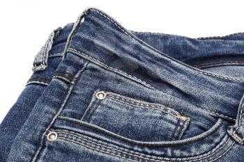 Fragment of dark blue jeans on white background